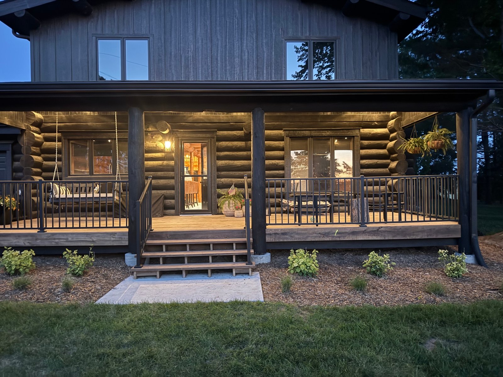 Three Cedars cabin lit up at night